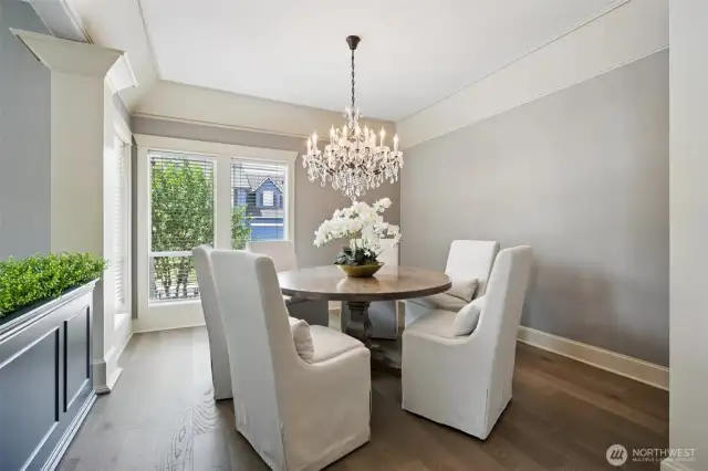 efined and radiant, the formal dining room is anchored by a stunning RH 40” Rococo crystal chandelier that casts elegant light across soft-gray walls and wide-plank oak floors. Natural light streams through oversized windows, creating a serene setting for dinner parties or morning tea in timeless style.