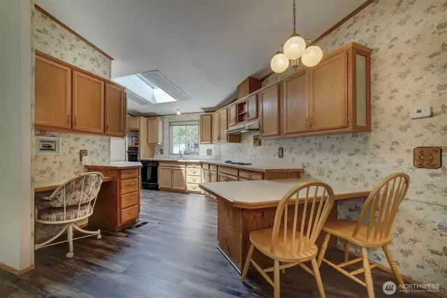Begin with a dream kitchen. Enjoy a breakfast spot at the peninsula and a convenient kitchen desk.