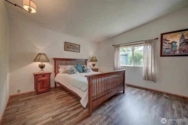 The principle bedroom is staged with a Queen size bed. Upsize to a King size bed and there is still plenty of room for additional furniture pieces.