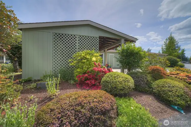 Please continue with a walking tour around the home to enjoy the gardens. Established plantings mean low maintenance but full enjoyment.