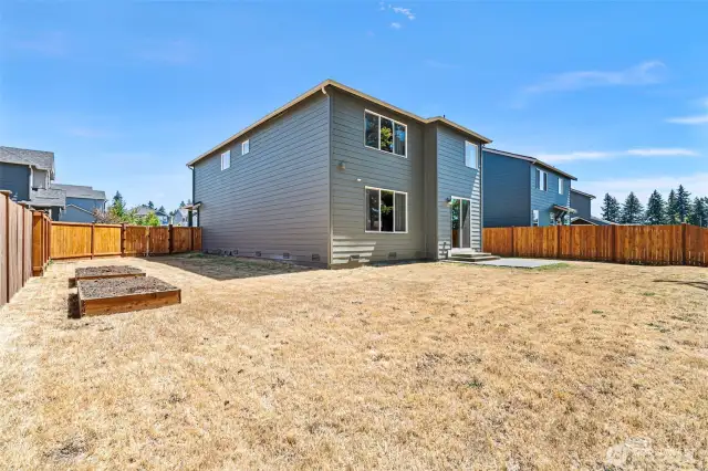 Outside, a generous backyard backs to a peaceful greenbelt for extra privacy.