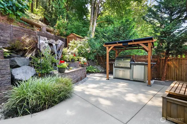 The backyard is dreamy.  A custom water fall built into an old maple cluster is soothing to the soul.  Grilling station is negotiable.