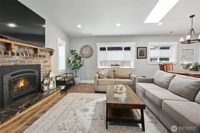 Vaulted ceilings with skylights and plenty of windows fill the main living spaces with natural light.
