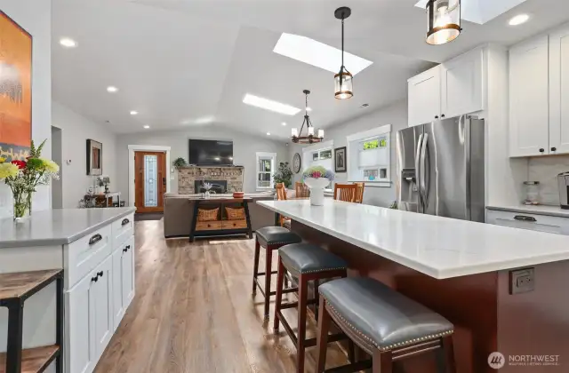 Huge island highlights a gorgeous, thoughtfully designed kitchen.