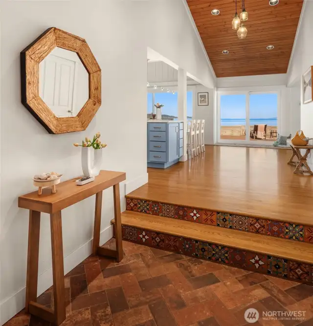 The covered entryway transports you from the busy world to your private waterfront oasis. Imagine this view welcoming you home every day.