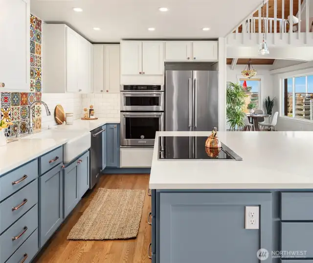 Gorgeous chef's kitchen with MSI Stone Stellar White Quartz countertops and Canyon Creek cabinets. Check out those stunning Mexican tiles!