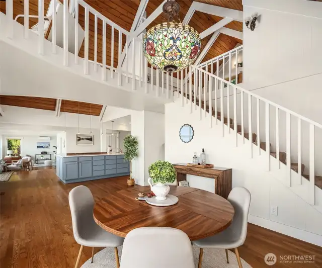 Fir tongue and groove vaulted ceiling, new floor to ceiling windows, and new oak flooring are just a few of the recent improvements. The open concept home flows beautifully from the inside to the outdoors.