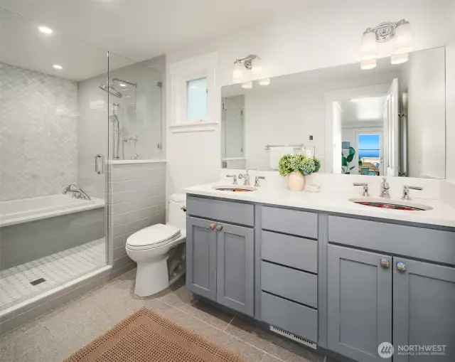 Calling this a "bathroom" is a disservice. The spa-like space, next to the primary bedroom, has a heated floor, double shower heads and sinks, exquisite tile work, imported ceramic sinks, and a HYDRO SYSTEM soaking tub. Learn about Hydro Fusion - https://hydrosystem.com/bath-tub-options/hydro-fusion/