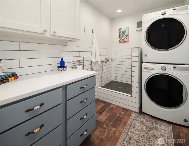 The multi-purpose room for laundry and showering your pooch sits next to the garage entrance off the living room.