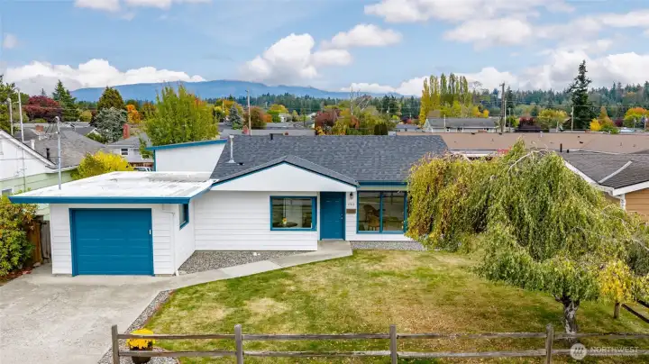 The front of the house is so inviting with a fresh coat of paint and a new roof.