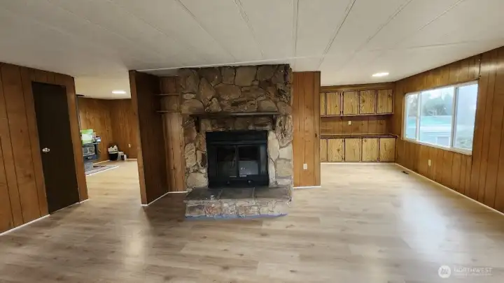 Walk into large open livingroom with wood burning fireplace!