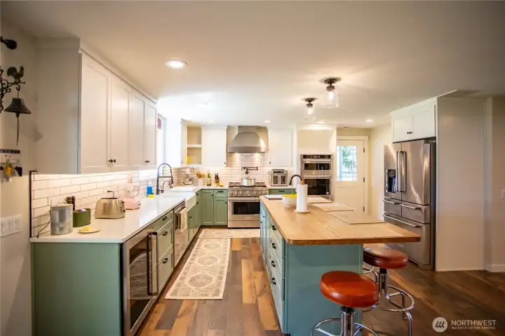 Gourmet kitchen with plenty of cabinets, counter space and beverage fridge