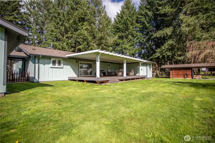 Large new cedar deck with custom aluminum awning; fenced in and enclosed chicken coop