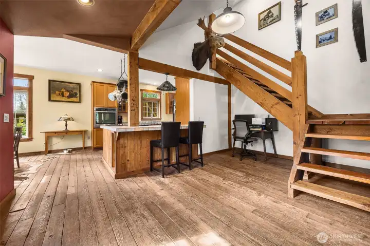 Living area with stairs to large upstairs bedroom.
