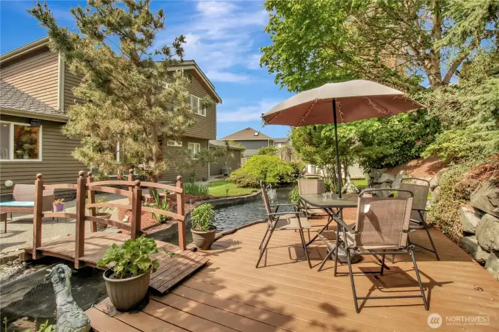 Bridge over Koi pond to sitting deck. . .