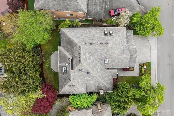 This stunning aerial view showcases the home's impressive footprint, beautifully manicured landscaping, and prime cul-de-sac location within the sought-after Sterling Woods community, surrounded by lush mature trees and tastefully maintained neighboring properties. The bird's-eye perspective perfectly illustrates the generous lot, well-designed outdoor spaces, and the exceptional privacy this remarkable Timberline home has to offer.