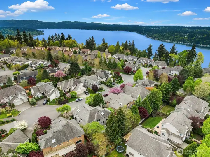 This spectacular aerial view reveals the home's incredible proximity to the sparkling waters of Lake Sammamish, with stunning panoramic views of the lake and surrounding Pacific Northwest landscape that perfectly capture the extraordinary lifestyle this coveted Timberline location affords. A truly rare and breathtaking perspective that underscores just how special this home and community really are.