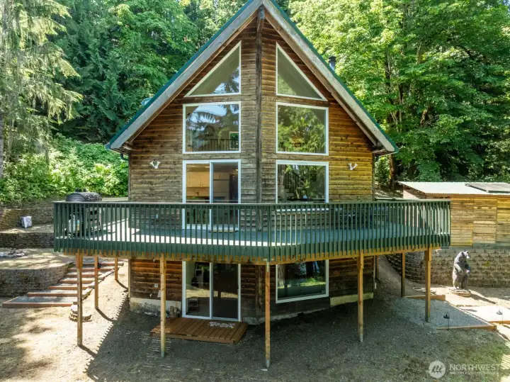Delightful wall of windows never tires of the lake and mountain views .  Gated wrap around deck is perfect to keep canine friends from unauthorized roaming on the 3 acres.