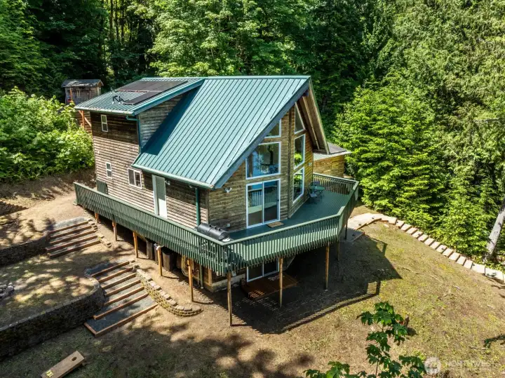 Gated wrap around deck is perfect to keep canine friends from unauthorized roaming on the 3 acres.