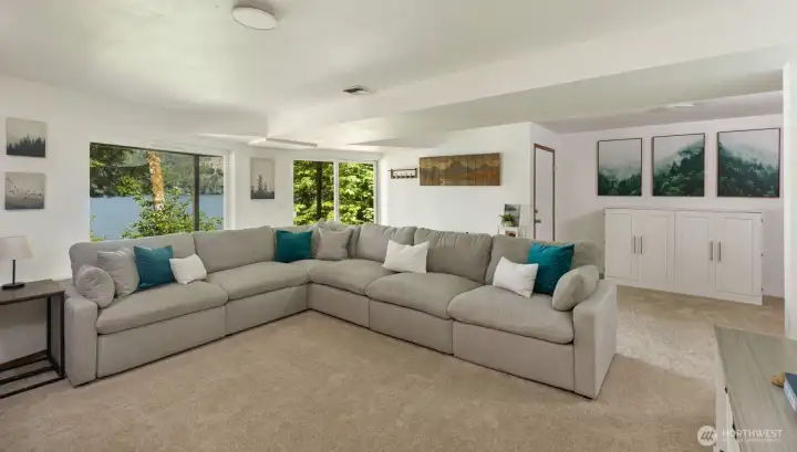 Enormous Rec Room allows for natural light but stays cool during the hot summer days.  White Murphy bed for additional guests conveys with the sale of the house.