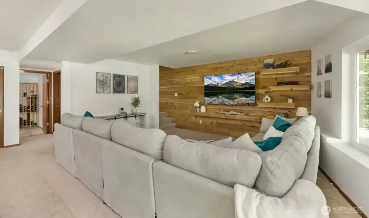 Huge Mounted TV in the expansive Rec Room onveys with the sale of the house to new owners.