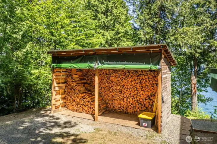 Woodshed with its' cords of wood convey with the home to the new owners.