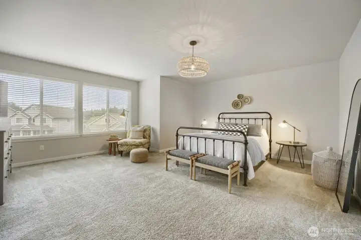 Generous bedroom filled with natural light.