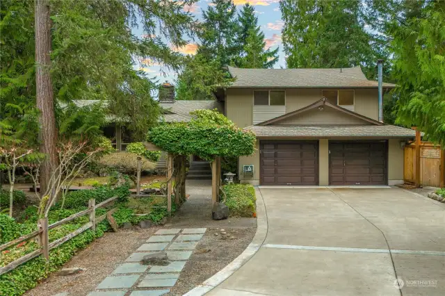 Paved driveway with lots of parking welcomes you to your beautifully landscaped property.