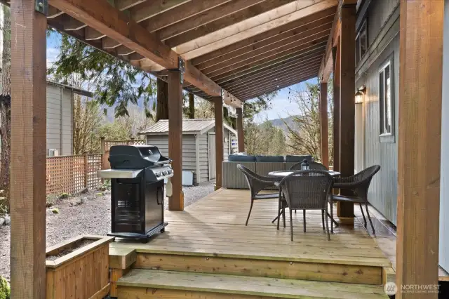 Covered deck with plenty of outdoor seating and a BBQ all included!
