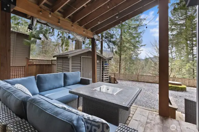 Covered deck with plenty of outdoor seating and a BBQ all included!
