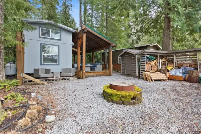 Firepit in the backyard overlooking the ravine. Shed and woodshed.