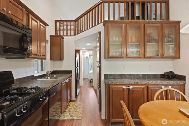 Kitchen, dining room with extra storage cabinets. And a loft!