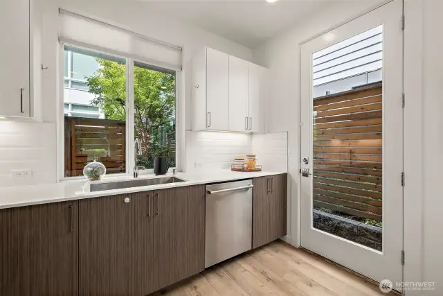 Side door leads to the backyard area, bike rack and private off street parking.