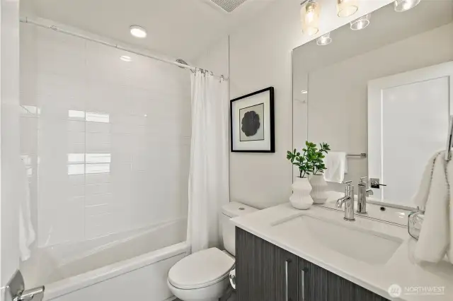 Full bath on level two between bedrooms 2 and 3.  Pottery Barn perfect.