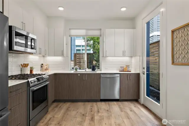 Side door leads to the backyard area, bike rack and private off street parking.