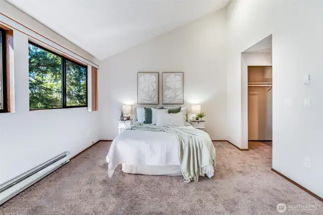 The primary bedroom opens onto a dual closet and full bathroom.