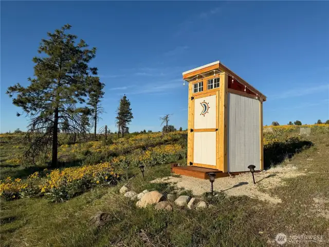 Clean, spacious outdoor bathroom.