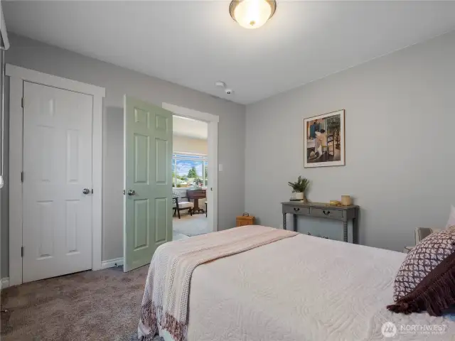 Bedroom #1 is located to the right of the living room.