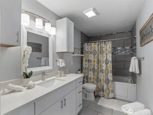 The sleek lines in this updated bathroom are so pretty.