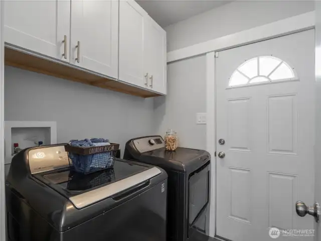 The separate laundry room has its own exit to the back yard. Washer and dryer convey with the home.