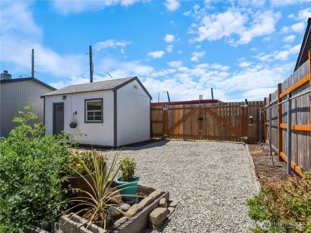 The quaint shed in the back is perfect for a craft room, office or to store your tools and toys.