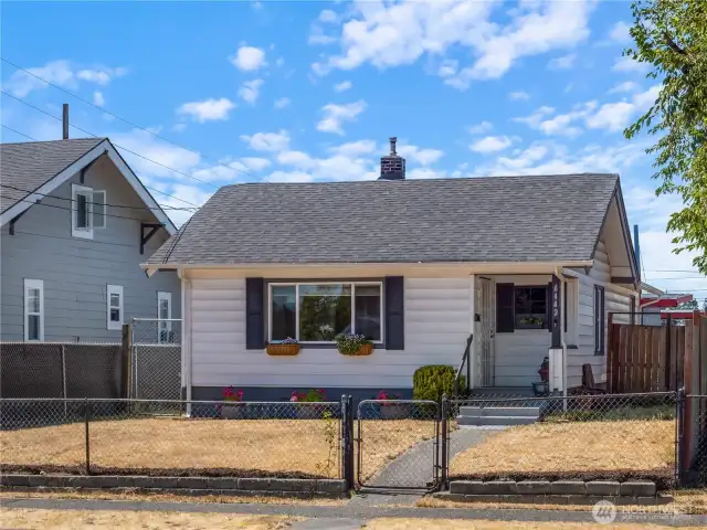 Fully fenced yard. Sidewalks and curbs.