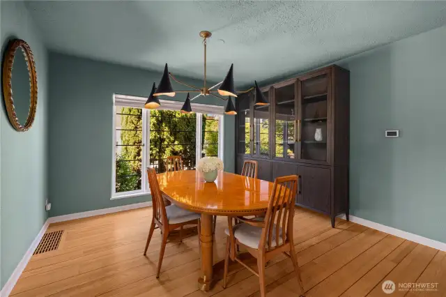 Grand dining room with beautiful cabinet from Restoration Hardware (conveys with the home!).