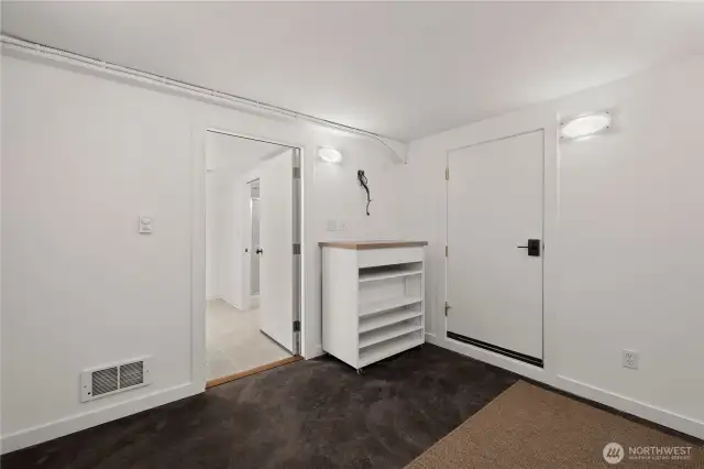 Bonus room for storage or workout room.  Door to the right leads to the garage.