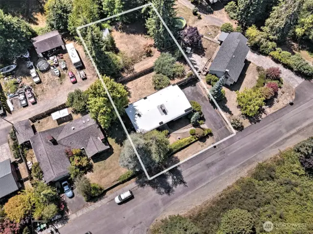 The sale also includes the vacant city lot behind it with the wood storage building. Great place to park your boat, RV or other items -  or build a workshop!