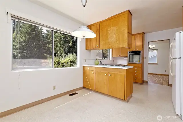 Eating space in the kitchen, but there is still a formal dining room through the doorway.