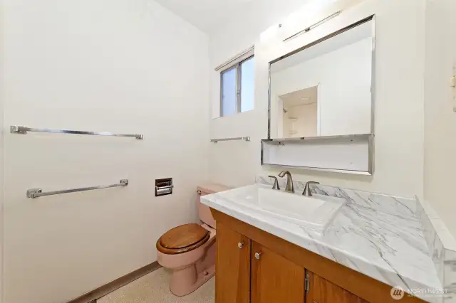 The bath off of the primary bedroom with a step-in shower.