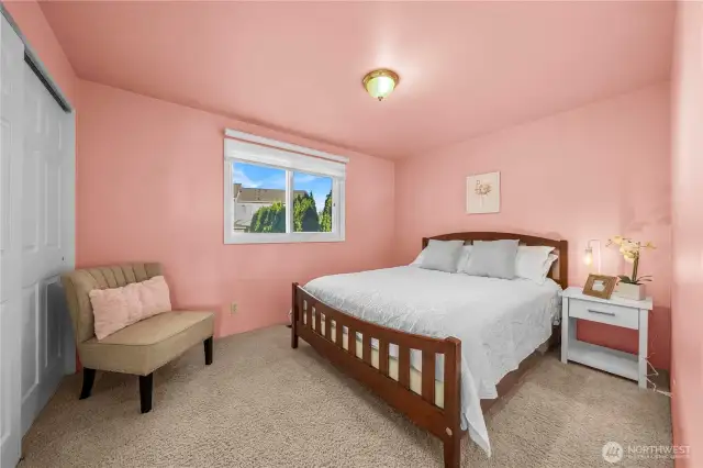Primary bedroom & adjacent bathroom.