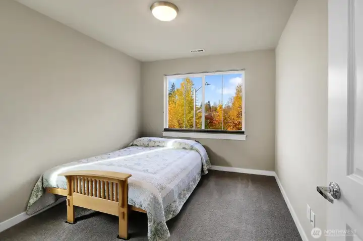 This is the second bedroom on the second floor. The views of the greenspace from here are soothing.