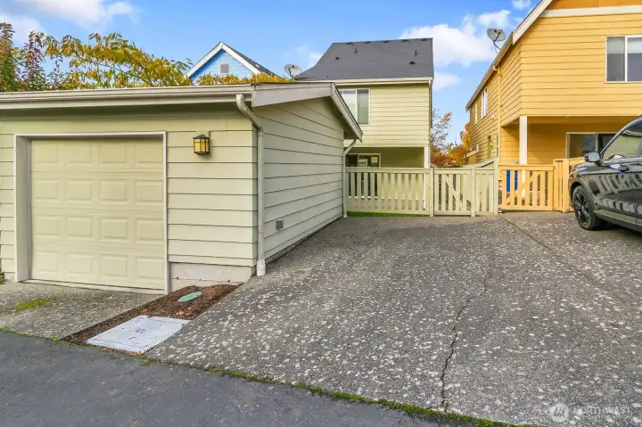 Detached garage with 2nd parking space off of wide alley steps from the Link Light Rail Station.